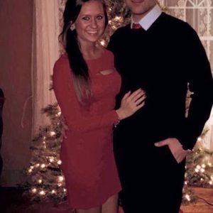 Red, long sleeve bodycon dress w/ top slit. GUESS